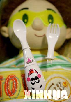 The latest gadget in baby spoons -- a "singing" spoon is shown at a shop in Huaibei, Anhui province selling baby accessories, on September 10, 2006. The product has a built-in stereo which plays children's songs to attract the baby's attention and stimulate his or her appetite.
