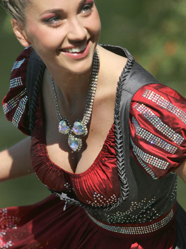 Model Regina Deutinger dressed in the world's most expensive Dirndl dress poses for photographers during the presentation in Munich, September 13, 2006. The traditional Bavarian Dirndl dress is covered with Swarovski jewels and costs 100,000 euros (about $127,000). 