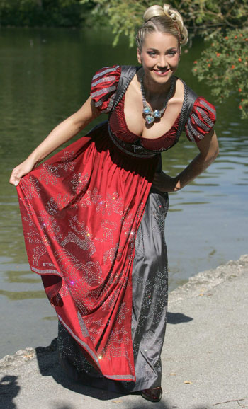 Model Regina Deutinger dressed in the world's most expensive Dirndl poses for photographers during the presentation in Munich, September 13, 2006. 