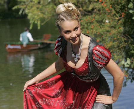 Model Regina Deutinger dressed in the world's most expensive Dirndl poses for photographers during the presentation in Munich, September 13, 2006.