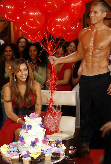Singer Beyonce (L) is surprised with a birthday cake and balloons while being interviewed for television's "Live@Much" series in Toronto September 14, 2006. Beyonce is currently promoting her brand-new solo album "B'Day". 
