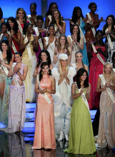 Miss World 2006 candidates applaud during a rehearsal on the night before the 56th Miss World 2006 competition in Warsaw September 29, 2006. Poland is the first of East Europe's former communist countries to host Miss World and, in keeping with its conversion to capitalism, is aiming to cash in on the exposure.