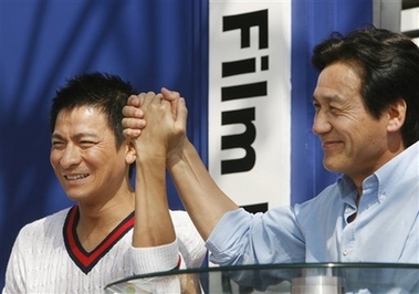 Hong Kong movie star Andy Lau, left, and South Korean actor Ahn Sung-ki hold hands as they attend an event as part of the 11th Pusan International Film Festival in Busan, South Korea, Friday, Oct. 13, 2006. 