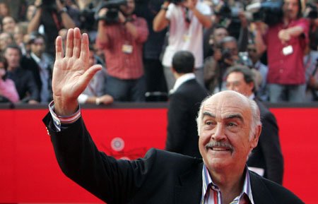 British actor Sean Connery waves to his fans as he arrives at the screening of his movie "The Bowler and the Bunnet" at the Auditorium during Rome's first international film festival October 13, 2006.