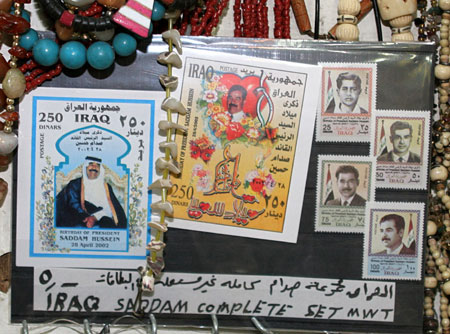 Stamps depicting former Iraqi President Saddam Hussein are displayed for sale at a Jordanian souvenir store in Amman November 5, 2006. A visibly shaken Saddam Hussein was found guilty of crimes against humanity and sentenced to hang on Sunday at a lightning session of the U.S.-backed court trying him in Baghdad.