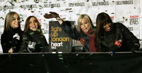 British pop group All Saints cheer as they turn on the Oxford Street Christmas Lights in central London November 9, 2006.