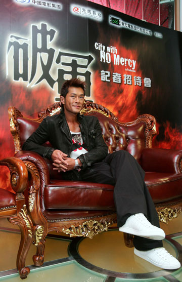 Hong Kong actor Louis Koo poses during a news conference to promote his movie 
