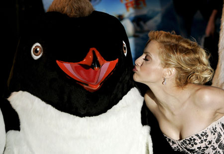 Actress Brittany Murphy kisses a 