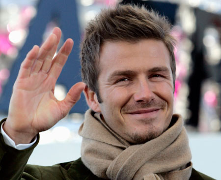 Soccer player David Beckham of England waves to his fans at a promotional event in Tokyo December 29, 2006.
