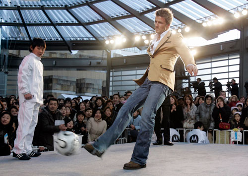 Soccer player David Beckham of England kicks a ball at a promotional event in Tokyo December 29, 2006.