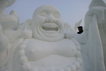 A man prepares for a snow sculpture art exhibition in the upcoming China Harbin international ice and snow festival in Harbin, northeastern China's Heilongjiang province, January 3, 2007.