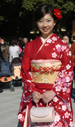 A woman in kimono attends a ceremony celebrating her Coming of Age Day at Toshimaen amusement park in Tokyo January 8, 2007.