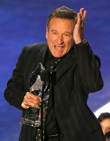 Robin Williams holds his award for funniest male actor at the 33rd annual People's Choice Awards in Los Angeles, California January 9, 2007. 
