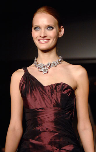 A model wears a Vera Wang dress, worn by Keira Knightley, and a necklace by Fred Leighton at 