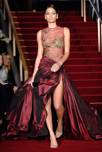 A model wears an Eli Saab dress, worn by actress Halle Berry from the red carpet in 2001 , at 