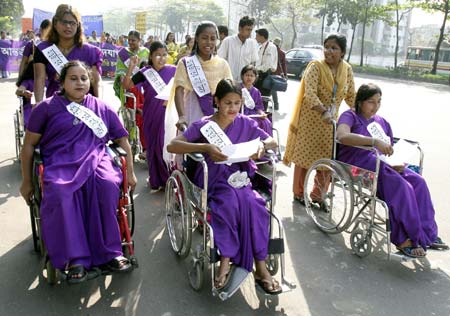 Disabled women lead a march to protest against violence aimed at women on international Women's Day in Dhaka March 8, 2007. 
