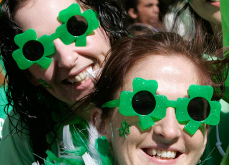 Irish women wear clover-shaped sunglasses as they watch a parade to celebrate Saint Patrick's Day in Tokyo March 18, 2007.