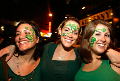 Revelers celebrating Saint Patrick's Day pose for the camera in Buenos Aires city centre March 17, 2007.