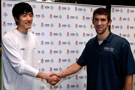 China's Olympic champion Liu Xiang (L) and America's swimming star Michael Phelps shake hands at the track and field training area of the General Administration of Sports of China in Beijing April 10, 2007. Phelps visited Liu during a visit to promote the 2007 Special Olympics, to be held in Shanghai in October.
