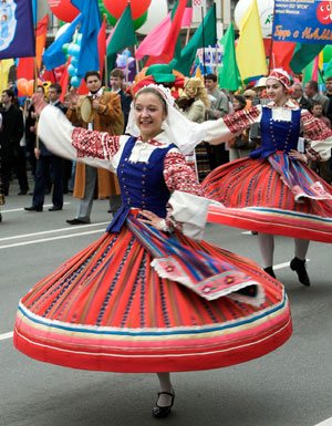 Women in Belarussian national dresses dance during a rally marking Victory Day in central Minsk May 9, 2007. Belarus celebrated on Wednesday the 62nd anniversary of the World War Two victory over Nazi Germany.