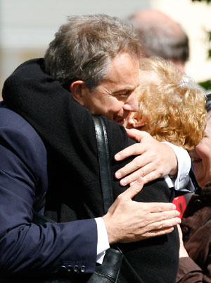 Britain's Prime Minister Tony Blair (L) embraces supporter as he arrives at Trimdon Constituency Labour Club in Trimdon, northeast England May 10, 2007. 