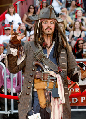 An unidentifed guest dressed as character Captain Jack Sparrow arrives at the premiere of 