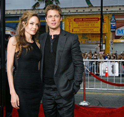 Cast member Brad Pitt (R) and actress Angelina Jolie pose at the premiere of 