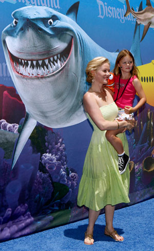 Actress Penelope Ann Miller and her daughter Eloisa pose as celebrities and their kids arrive for a preview of the new 