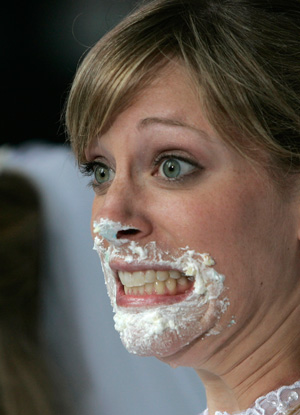 A contestant reacts after competing in the WE tv network's 'Bridezilla-Ultimate Cake Eating Contest' in New York's Times Square June 12, 2007. 