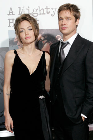 Actors Brad Pitt and Angelina Jolie arrive for the movie premiere of 'A Mighty Heart' in New York, June 13, 2007.