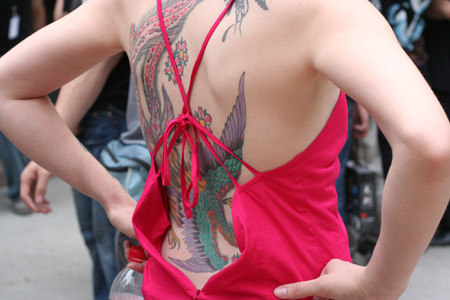 A girl shows her tattoos during the Tattoo Show Convention China 2007 in Beijing June 16, 2007.