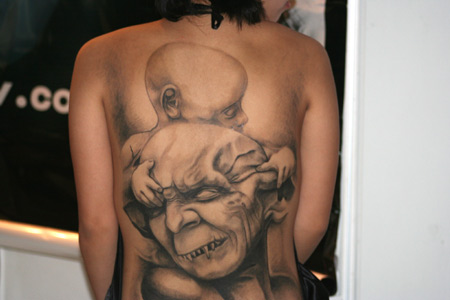 The tattoos on a girl's back during the Tattoo Show Convention China 2007 in Beijing June 16, 2007.