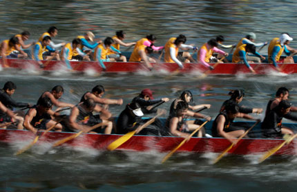 Participants compete in a dragon boat race at Aberdeen Harbour in Hong Kong to mark the annual Tuen Ng or Dragon Boat Festival June 19, 2007. The festival commemorates the tale of the third century B.C. poet in China who hurled himself into a river to protest against the corrupt government.