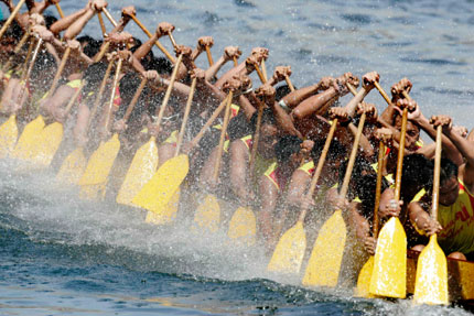 Participants compete in a dragon boat race at Aberdeen Harbour in Hong Kong to mark the annual Tuen Ng or Dragon Boat Festival June 19, 2007.