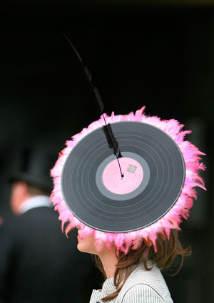 A race-goer with a hat made of an LP record arrives for Ladies Day on the third day of racing at the Royal Ascot meeting June 21, 2007. 