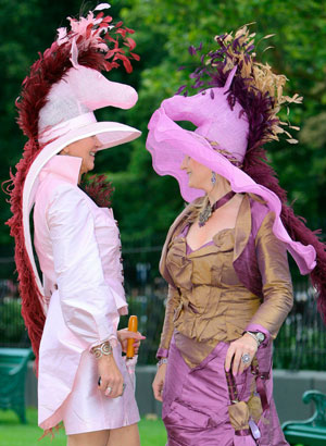 Race-goers with horse design hats arrive for Ladies Day on the third day of racing at the Royal Ascot meeting June 21, 2007.
