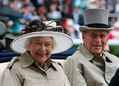 Britain's Queen Elizabeth (L) and Prince Phillip arrive for Ladies Day on the third day of the Royal Ascot horse racing meet June 21, 2007. 