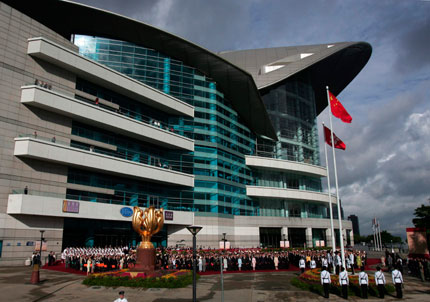 Top Hong Kong officials and guests attend a flag-raising ceremony outside the Hong Kong Convention and Exhibition Centre July 1, 2007, the day marking the 10th anniversary of Hong Kong's handover to Chinese rule.