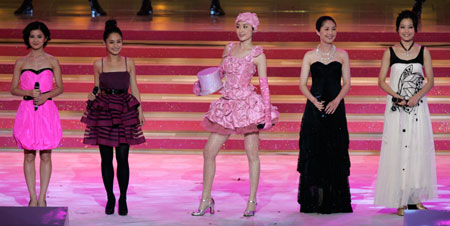 (From L) Hong Kong singers Charlene Choi, Gillian Chung, Kelly Chan, Miriam Yeung and Joey Yung perform during the Grand Variety Show in Hong Kong June 30, 2007. The show is part of a series of events celebrating the 10th anniversary of Hong Kong's handover to China.