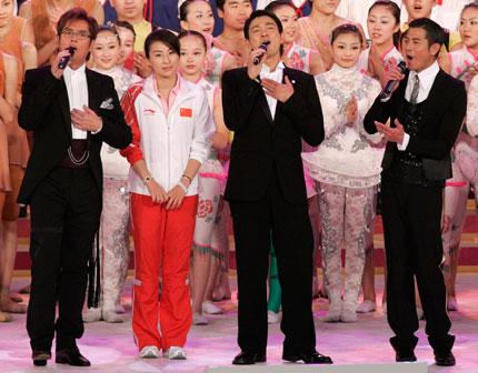 (From L) Hong Kong singer Alan Tam, Chinese athlete Guo Jingjing, singer Andy Lau and Aaron Kwok perform during the Grand Variety Show in Hong Kong June 30, 2007. The show is part of a series of events celebrating the 10th anniversary of Hong Kong's handover to China. 