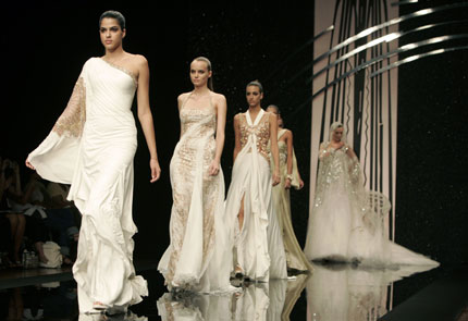 Models display creations from Lebanese fashion designer Abed Mahfouz's autumn/winter collection at the Auditorium hall during Rome Fashion Week July 12, 2007.