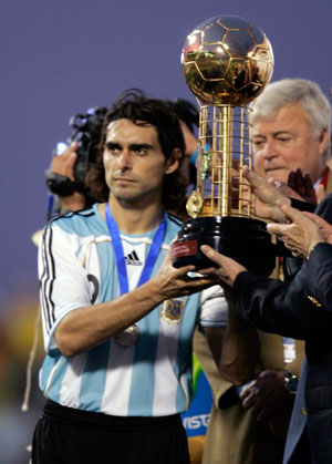 Argentina's Roberto Ayala holds the trophy for the second place after losing to Brazil in the final of the Copa America soccer match in Maracaibo July 15, 2007.