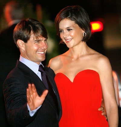 Actor Tom Cruise and his wife Katie Holmes pose at a party at the Museum of Contemporary Art in Los Angeles July 22, 2007.