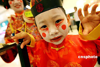 A child wears scary costumes to celebrate the forthcoming Halloween Festival in Hong Kong on Tuesday, Oct. 24, 2006. Halloween is celebrated on the night of Oct. 31.