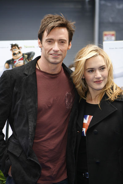 Actors Hugh Jackman (L) and Kate Winslet pose as they arrive for the premiere of the animated feature 