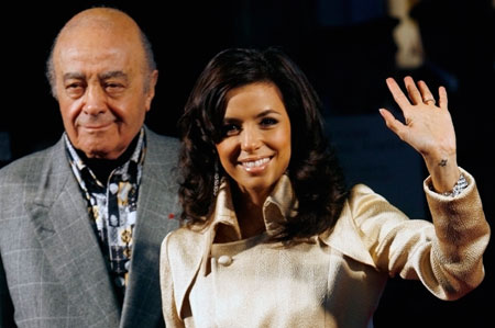 Actress Eva Longoria of the U.S. waves as she arrives with Harrods owner Mohamed Al Fayed for the official opening of the store's winter sale in central London December 28, 2006. 