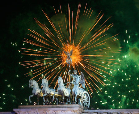 Fireworks explode over the Quadriga on top of Berlin's Brandenburg Gate during New Year celebrations early January 1, 2007. Several hundred thousand people gathered in the German capital to celebrate the New Year.