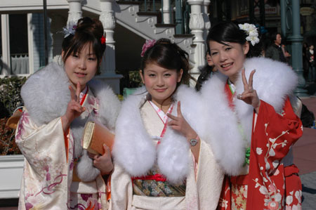 Three women in kimonos attend a ceremony celebrating their Coming of Age Day at Toshimaen amusement park in Tokyo January 8, 2007.