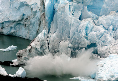 Pieces of ice fall from the front of the Perito Moreno glacier into the Lago Argentino, in the Parque Nacional Los Glaciares, 80 km (50 miles) west of the city El Calafate, in the Patagonian province of Santa Cruz, March 26, 2007.