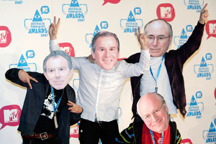 Members of the band Kisschasy pose while wearing masks depicting (L-R) Britain's Prime Minister Tony Blair, U.S. President George W. Bush, U.S. Vice President Dick Cheney and Australia's Prime Minister John Howard at the MTV Australia Video Music Awards in Sydney April 29, 2007.